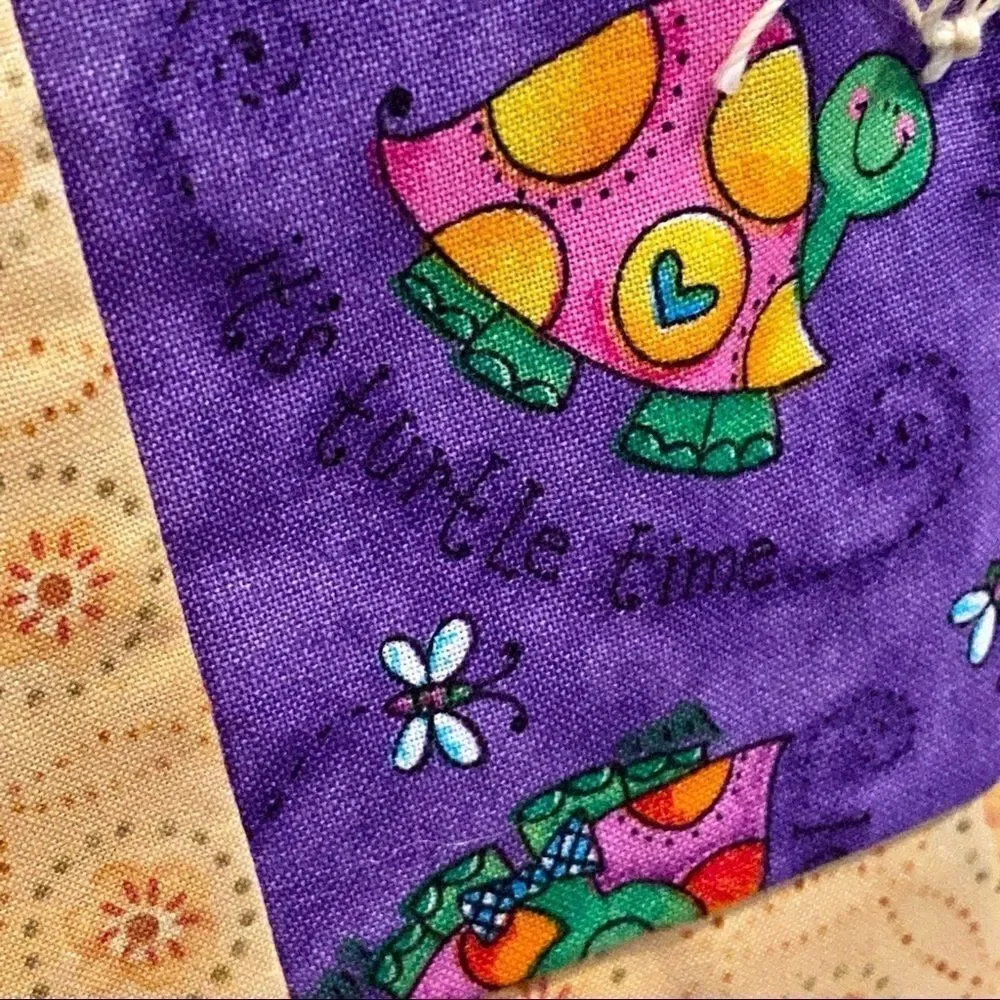Handmade NWT turtle themed purple and gold baby or lap quilt size 43” X 38”